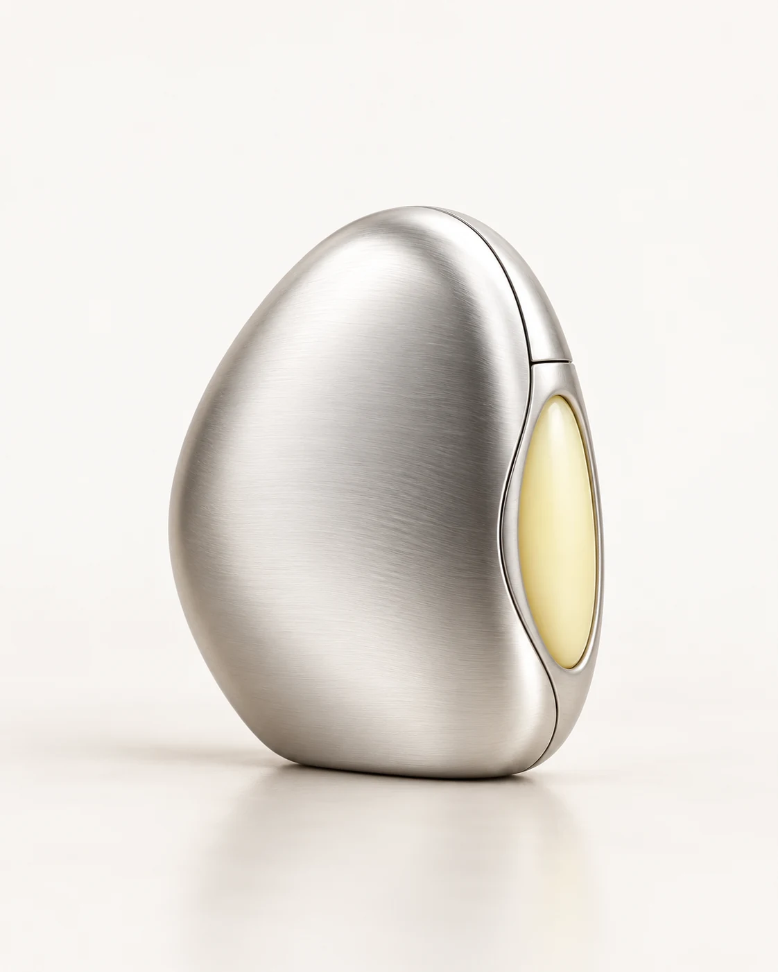 A quiet curve in brushed silver, with a trace of citron at its edge.
